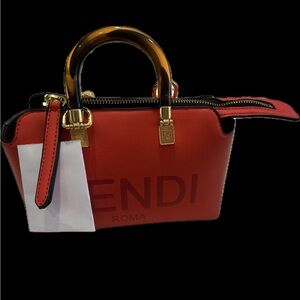 Red extra small Mini purse with crossbody straps included new never used